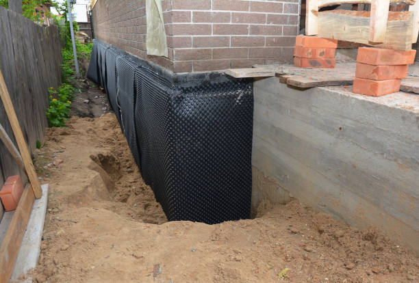 SJ Waterproofing Pros technician performing targeted Interior Drainage System assessment in Beaver Dam, WI